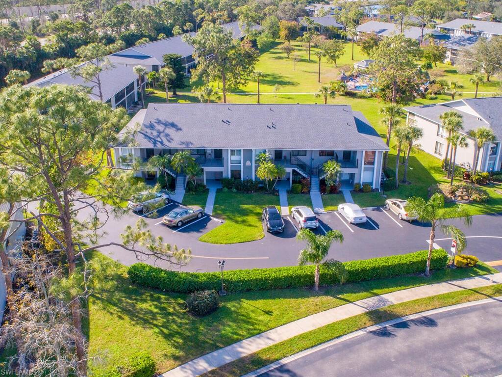 1232 Commonwealth Circle, Unit P102 Naples, FL 34116 - Photo 2 of 30 an aerial view of a house with swimming pool and yard