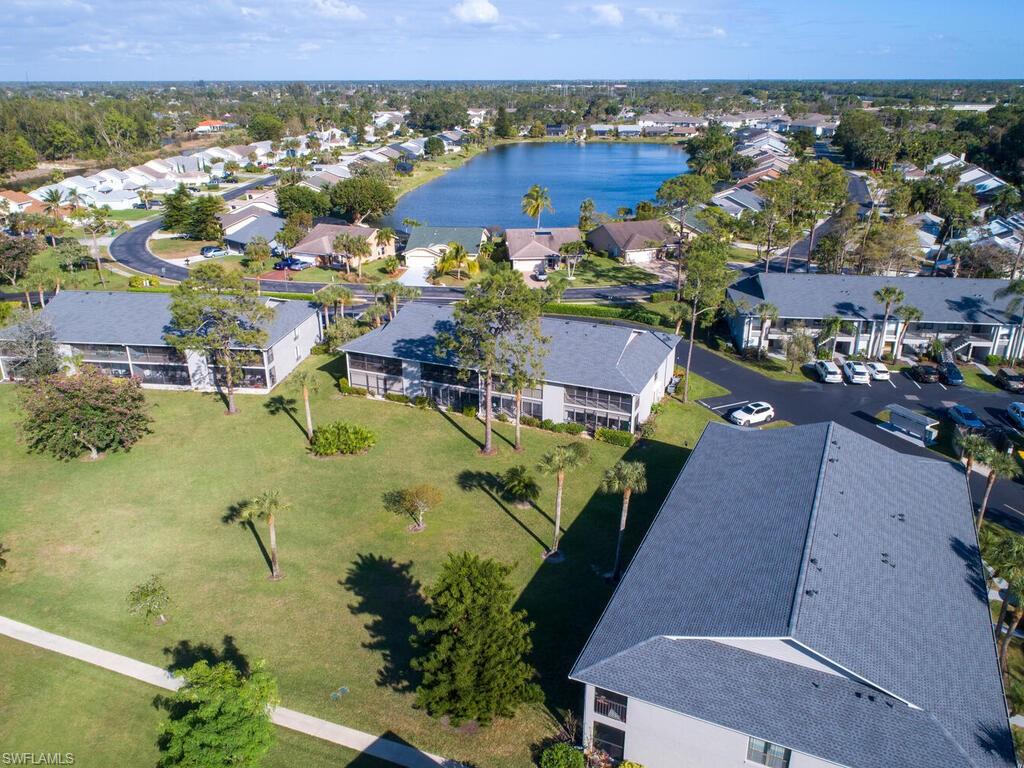 1232 Commonwealth Circle, Unit P102 Naples, FL 34116 - Photo 30 of 30 an aerial view of a house with a swimming pool