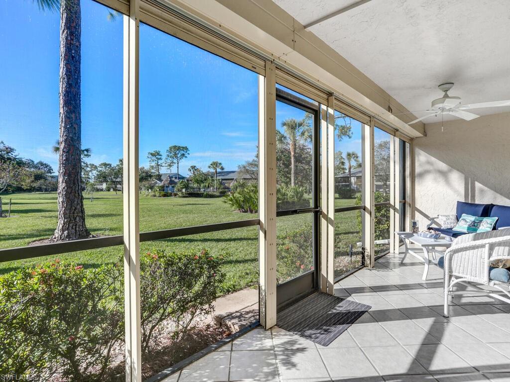 1232 Commonwealth Circle, Unit P102 Naples, FL 34116 - Photo 6 of 30 a view of a porch with a garden