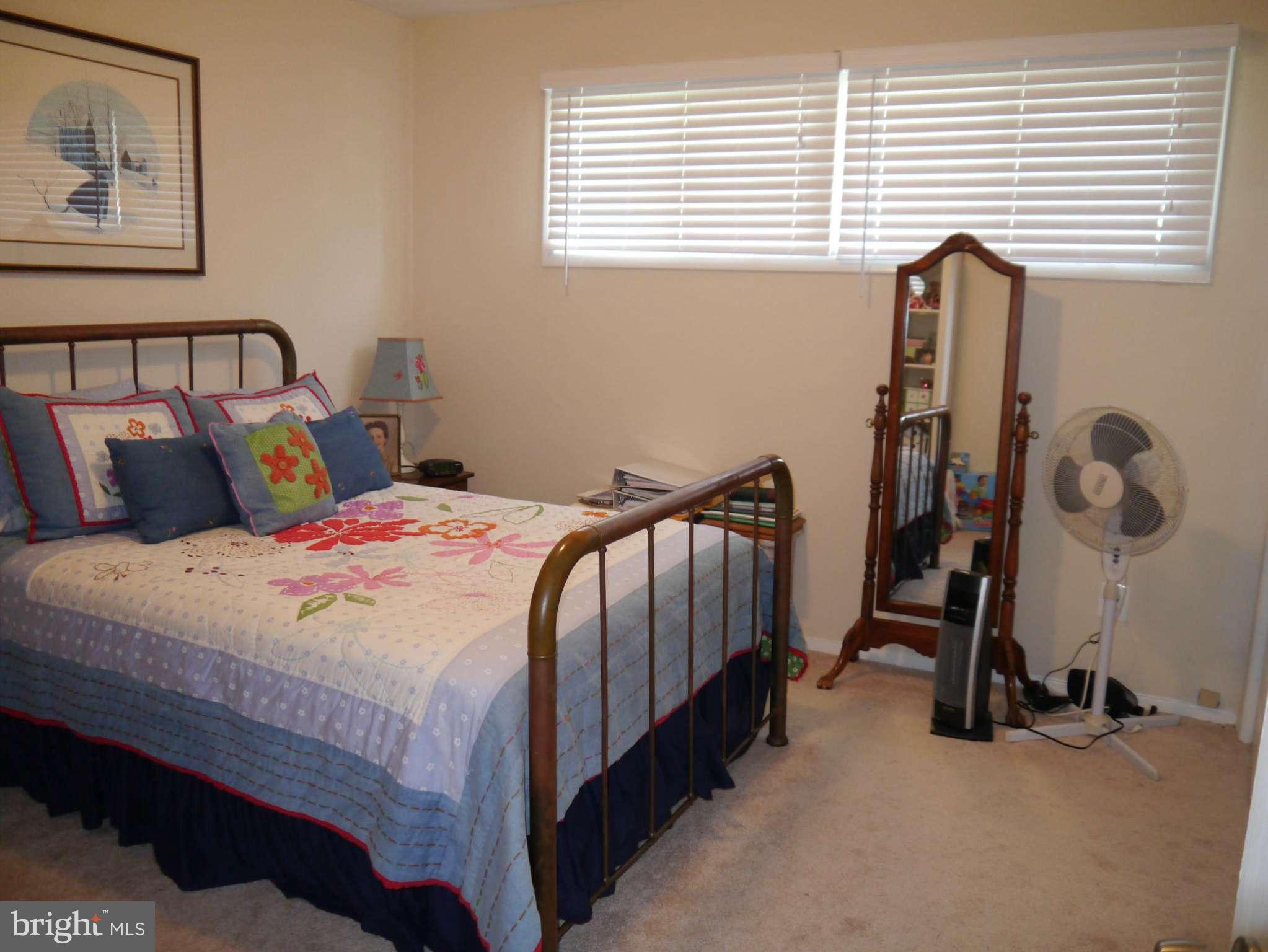 7412 Inzer Street Springfield, VA 22151 - Photo 13 of 27 a bedroom with a bed and a window
