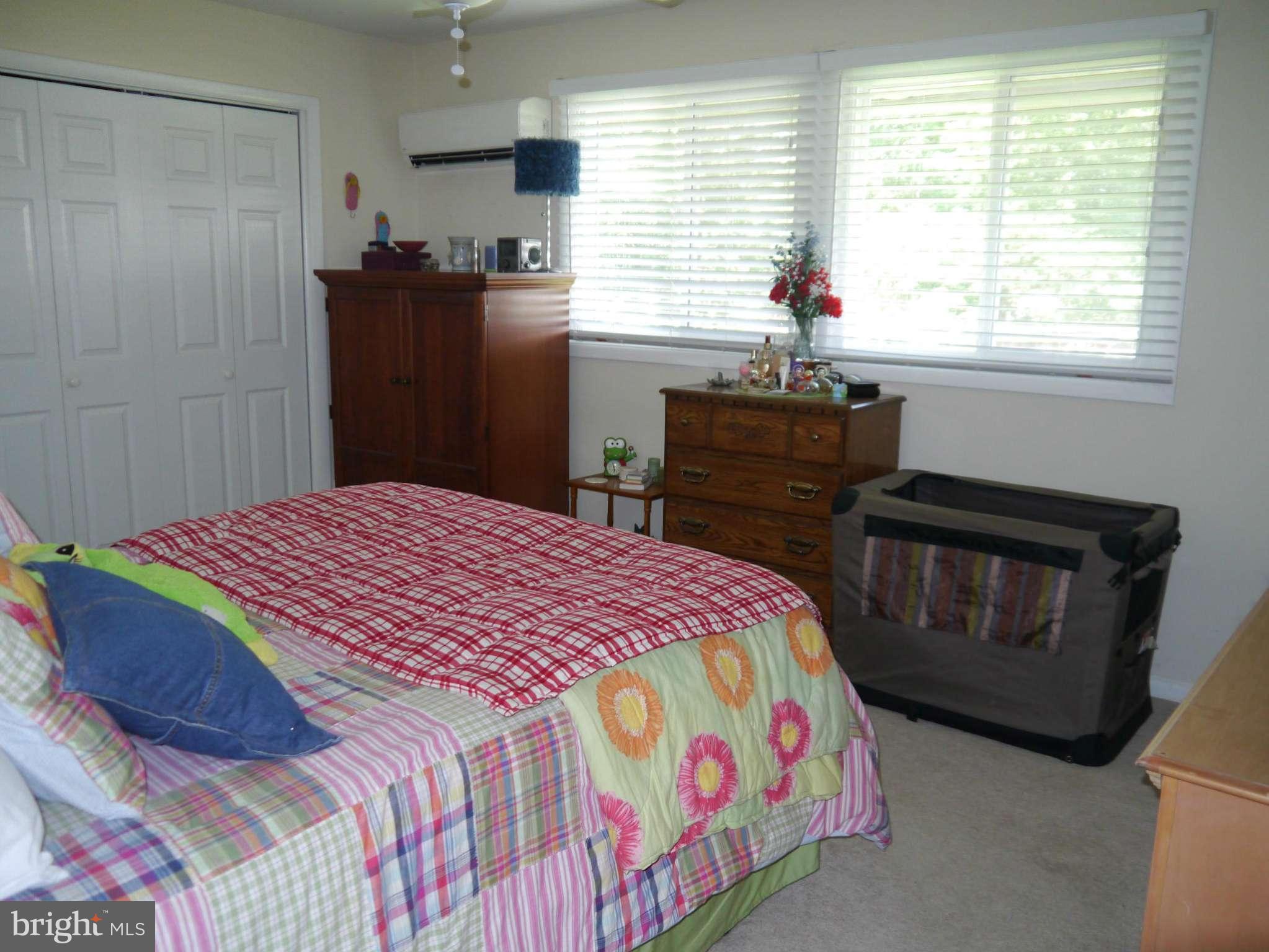 7412 Inzer Street Springfield, VA 22151 - Photo 17 of 27 a bedroom with a bed and a window