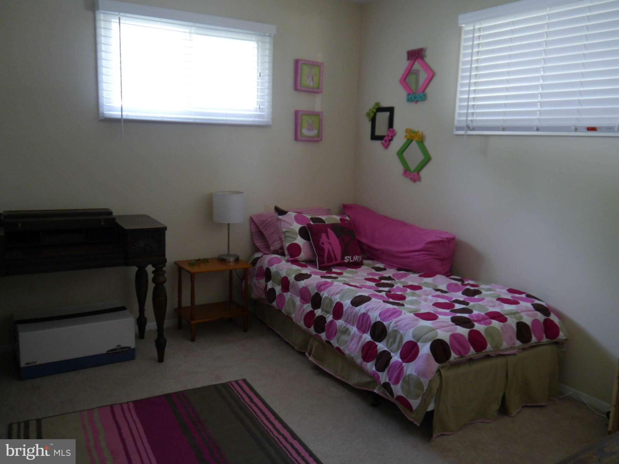 7412 Inzer Street Springfield, VA 22151 - Photo 19 of 27 a bedroom with a bed and a window
