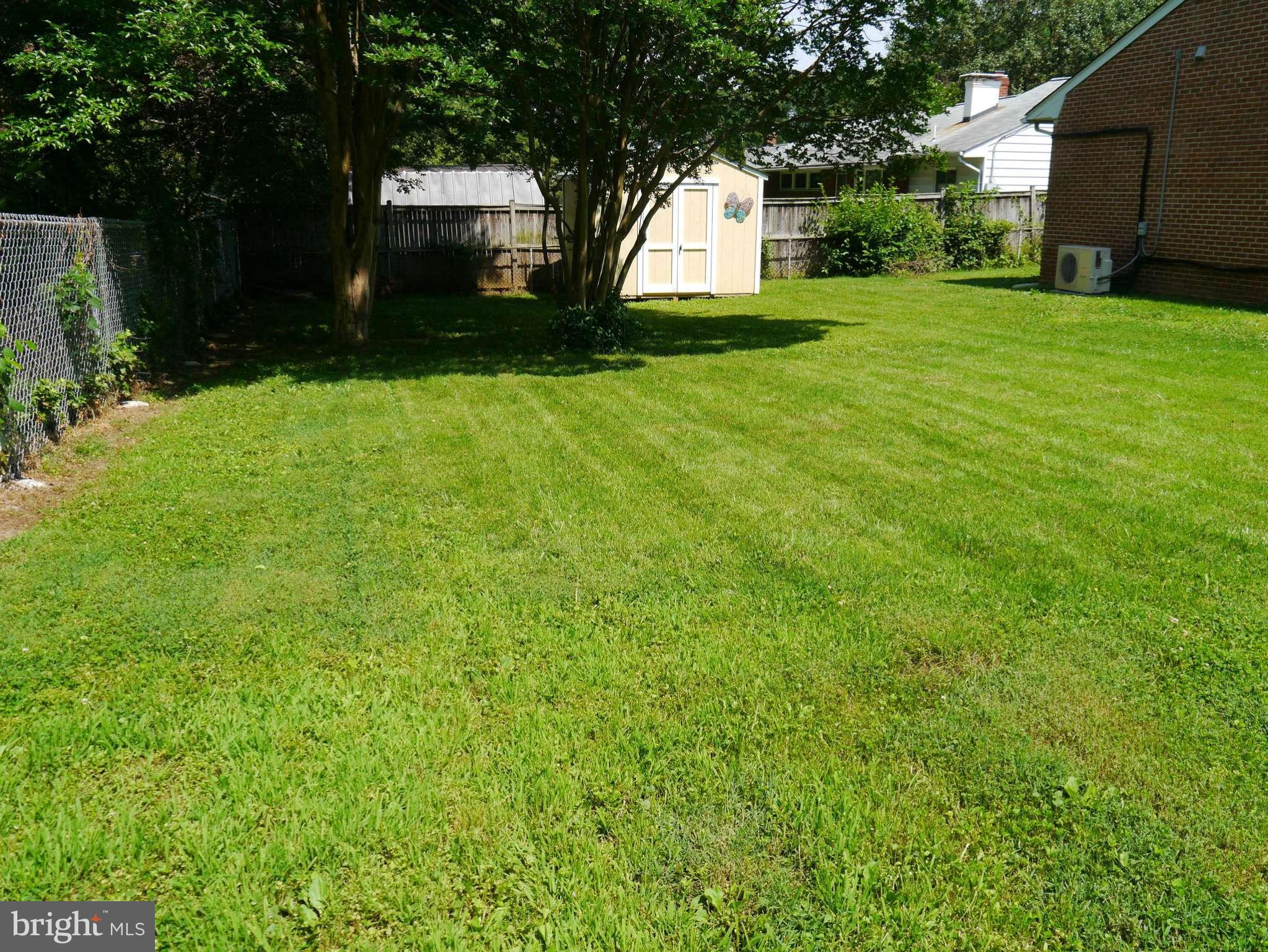 7412 Inzer Street Springfield, VA 22151 - Photo 21 of 27 a view of a backyard with large trees