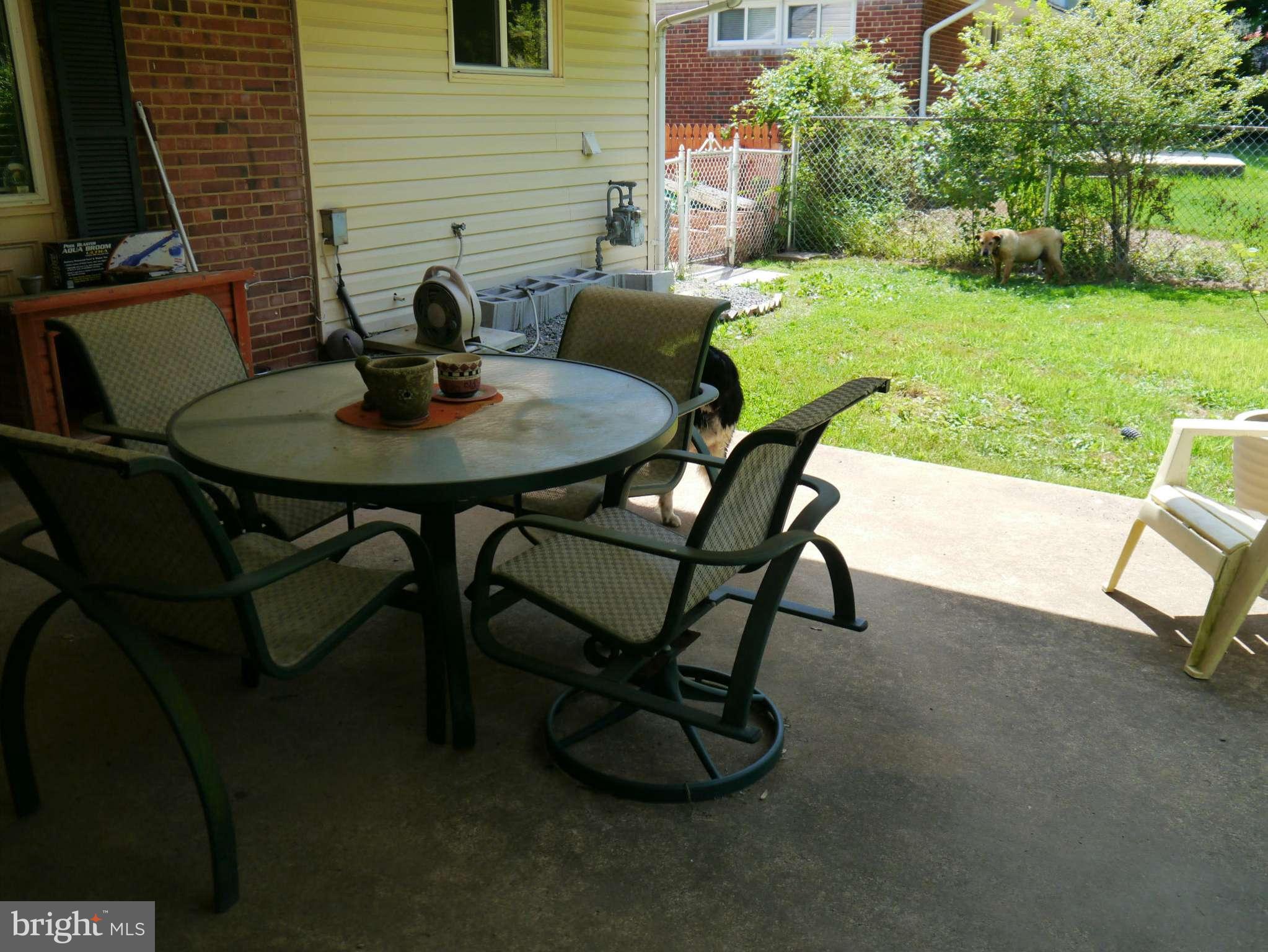 7412 Inzer Street Springfield, VA 22151 - Photo 24 of 27 a view of a yard with table and chairs