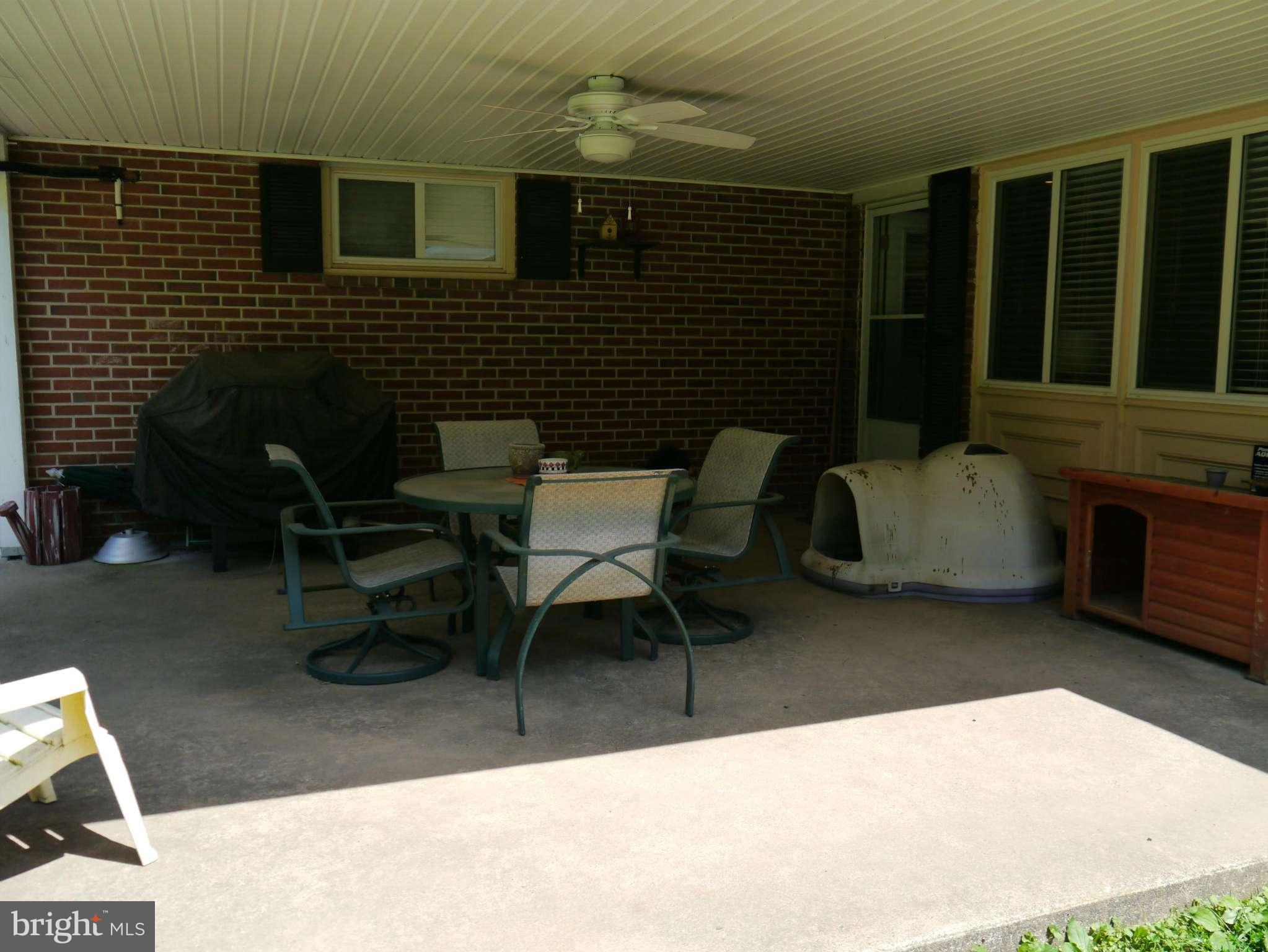 7412 Inzer Street Springfield, VA 22151 - Photo 26 of 27 a brick house with table and chairs