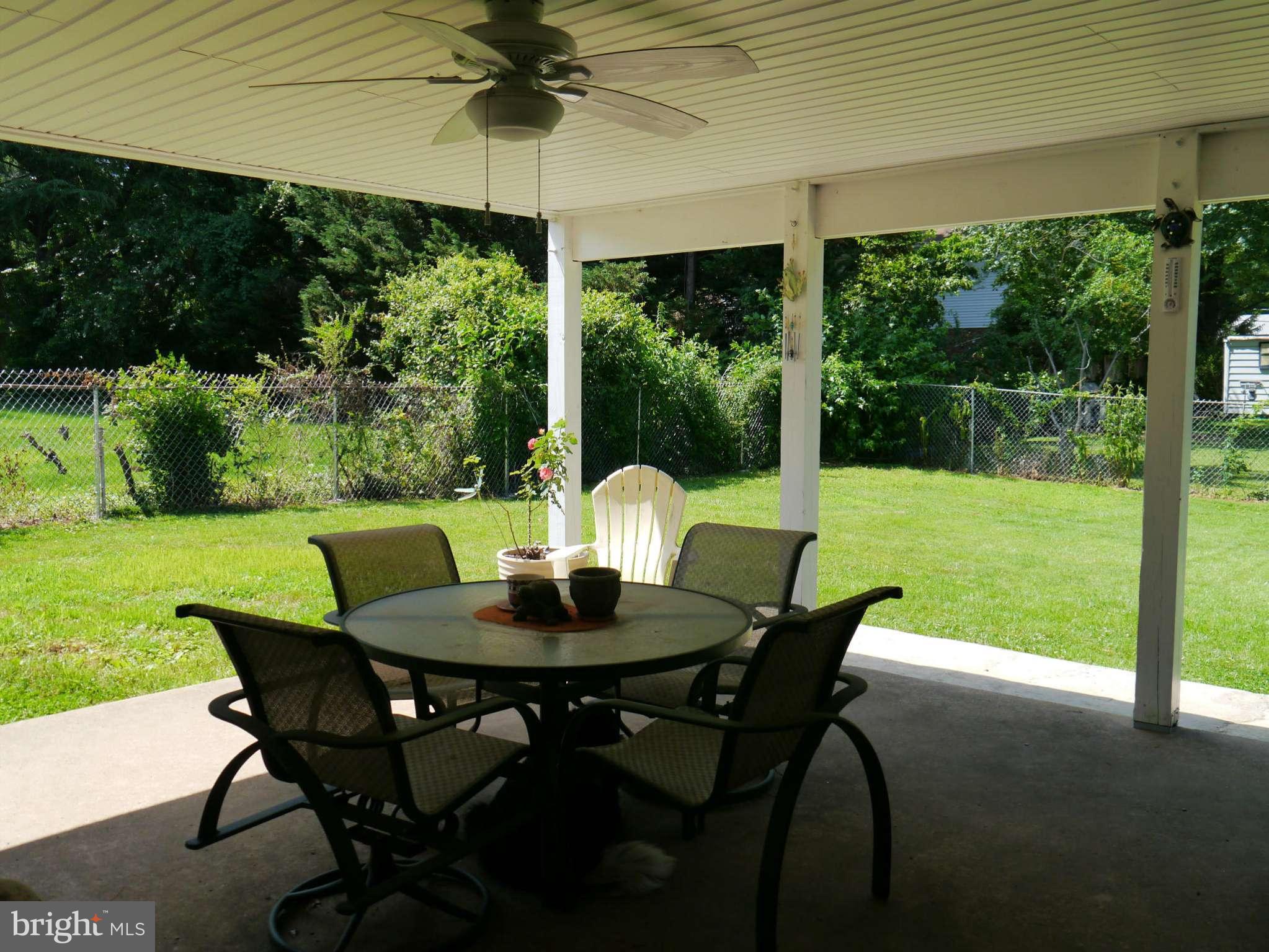 7412 Inzer Street Springfield, VA 22151 - Photo 27 of 27 a view of an outdoor dining space with furniture and garden
