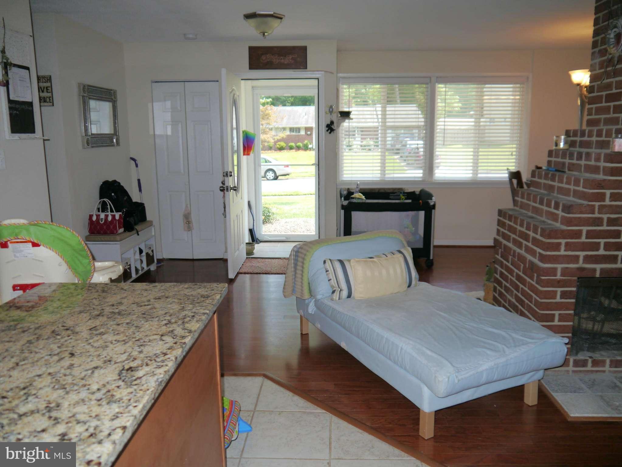 7412 Inzer Street Springfield, VA 22151 - Photo 7 of 27 a living room with furniture and large windows