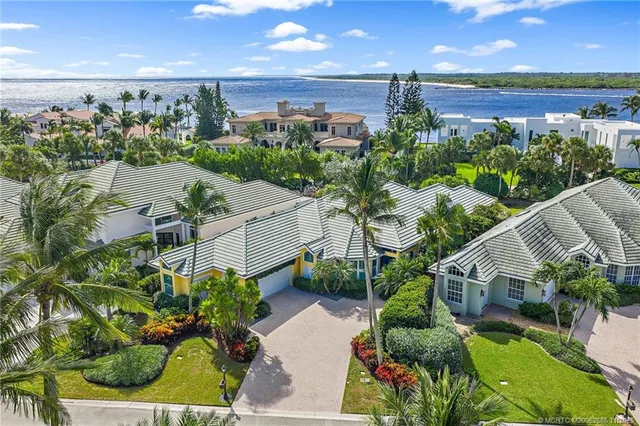 a view of a patio with table and chairs and potted plants