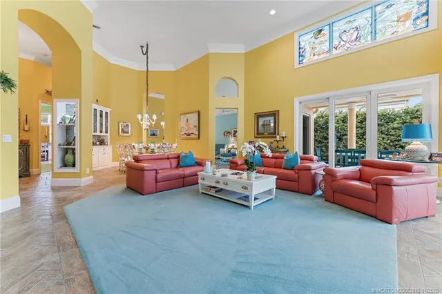 a view of a dining room with furniture and chandelier
