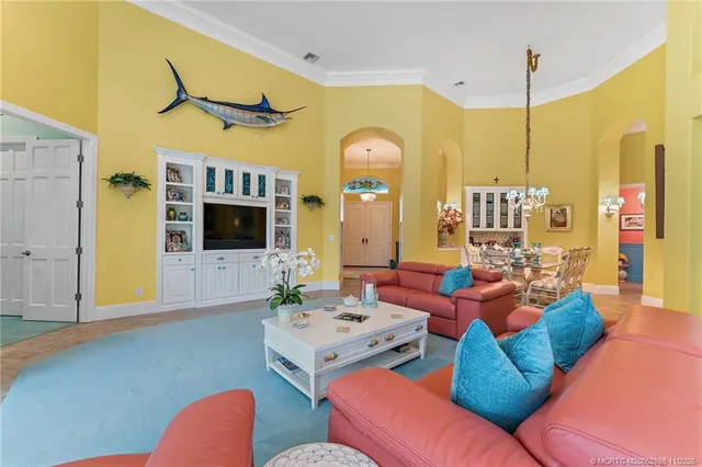 a kitchen with a sink a counter top space stainless steel appliances and cabinets