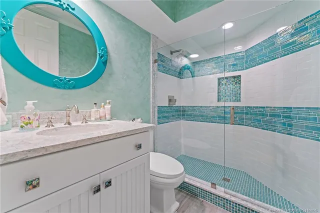 a bathroom with a sink mirror and a bathtub