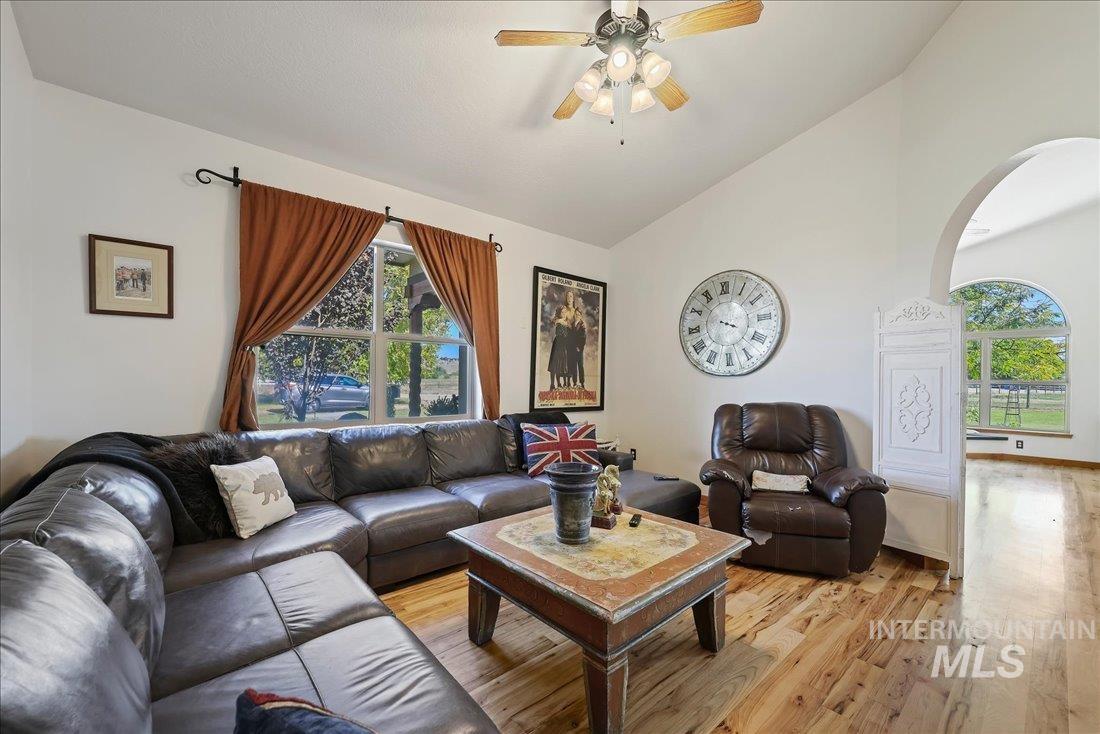 7639 Elko Lane Middleton, ID 83644 - Photo 19 of 47 Living room featuring light wood-style floors, a ceiling fan, and high vaulted ceiling