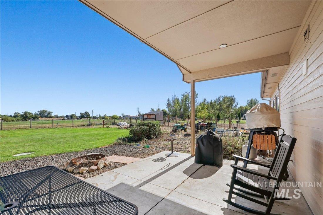 7639 Elko Lane Middleton, ID 83644 - Photo 30 of 47 Fenced backyard with a patio and a grill