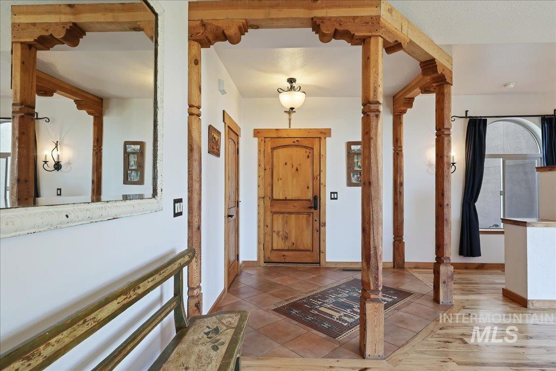 7639 Elko Lane Middleton, ID 83644 - Photo 7 of 47 Tiled foyer featuring baseboards and ornate columns