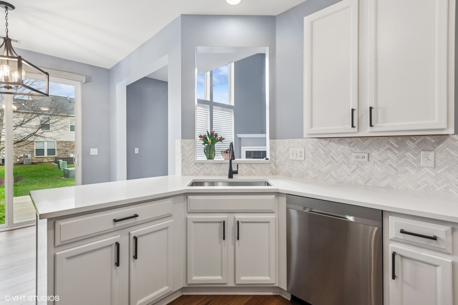 24843 Franklin Lane Plainfield, IL 60585 - Photo 5 of 18 a kitchen with white cabinets and a sink
