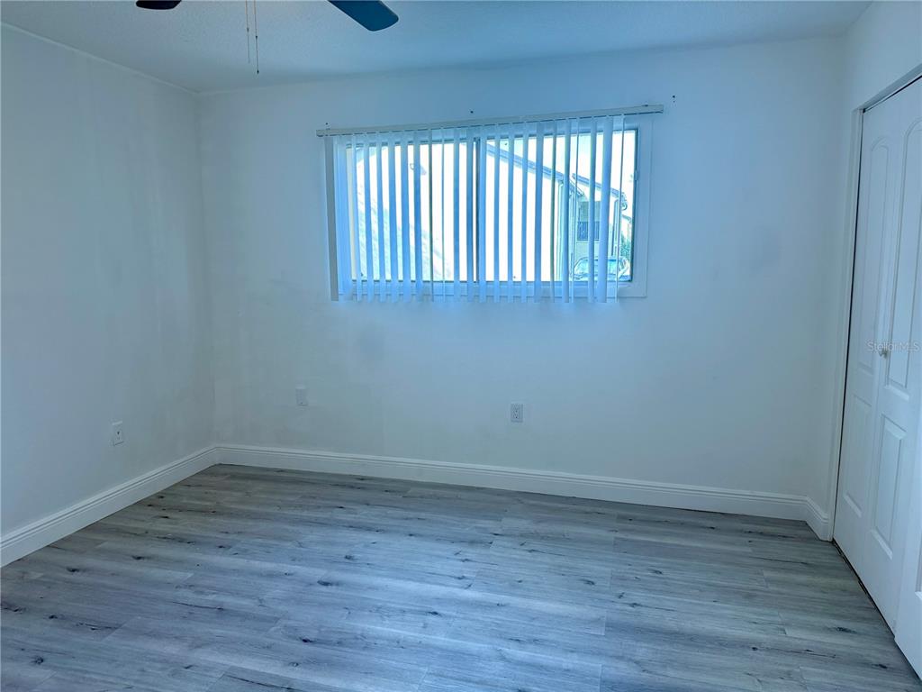 900 North Lake Destiny Road, Unit A Altamonte Springs, FL 32714 - Photo 14 of 26 a view of an empty room with wooden floor and a window