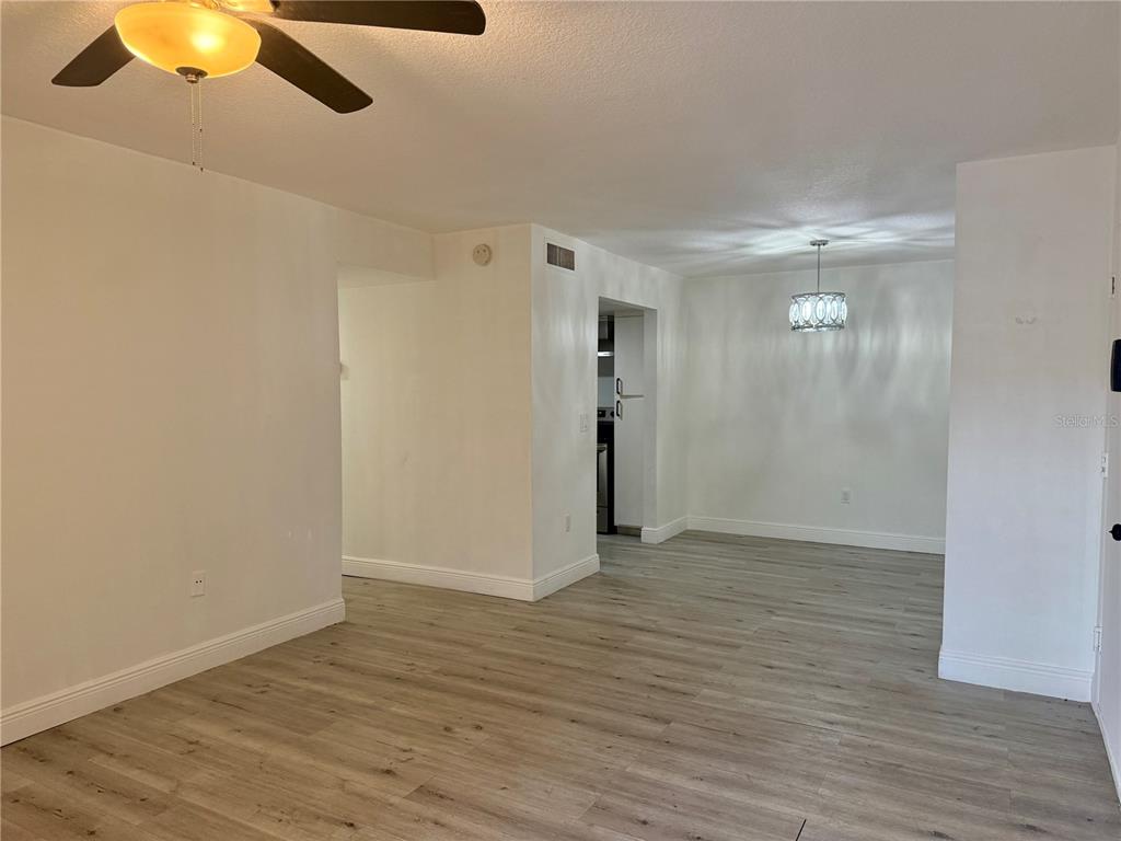900 North Lake Destiny Road, Unit A Altamonte Springs, FL 32714 - Photo 4 of 26 a view of an empty room with wooden floor