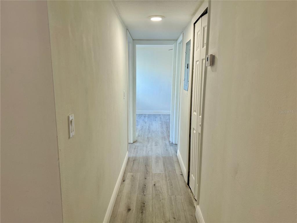900 North Lake Destiny Road, Unit A Altamonte Springs, FL 32714 - Photo 10 of 26 a view of a hallway with wooden floor and closet