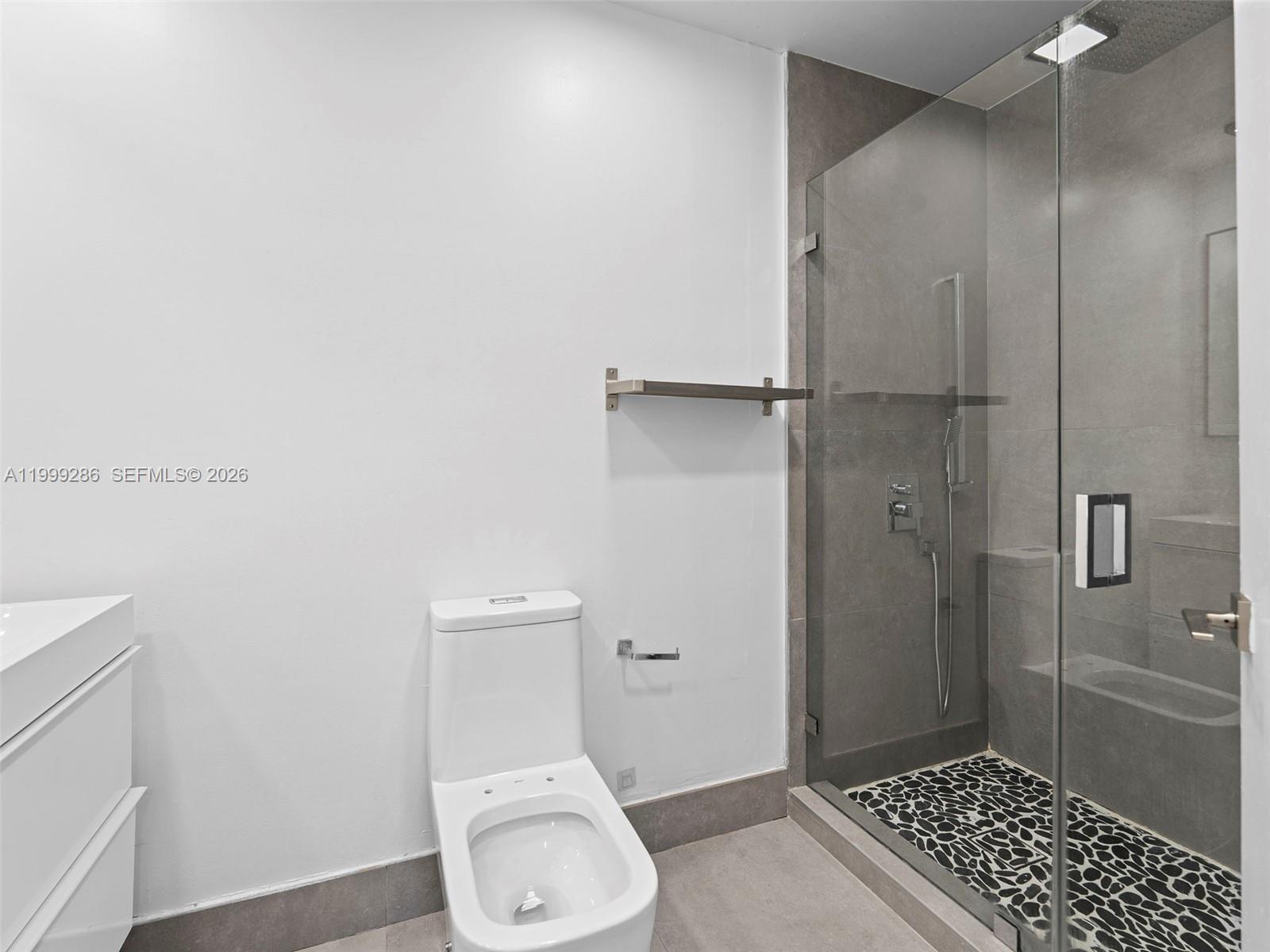 13404 Southwest 153 Terrace, Unit 2005 Miami, FL 33177 - Photo 28 of 49 a bathroom with a toilet and a shower
