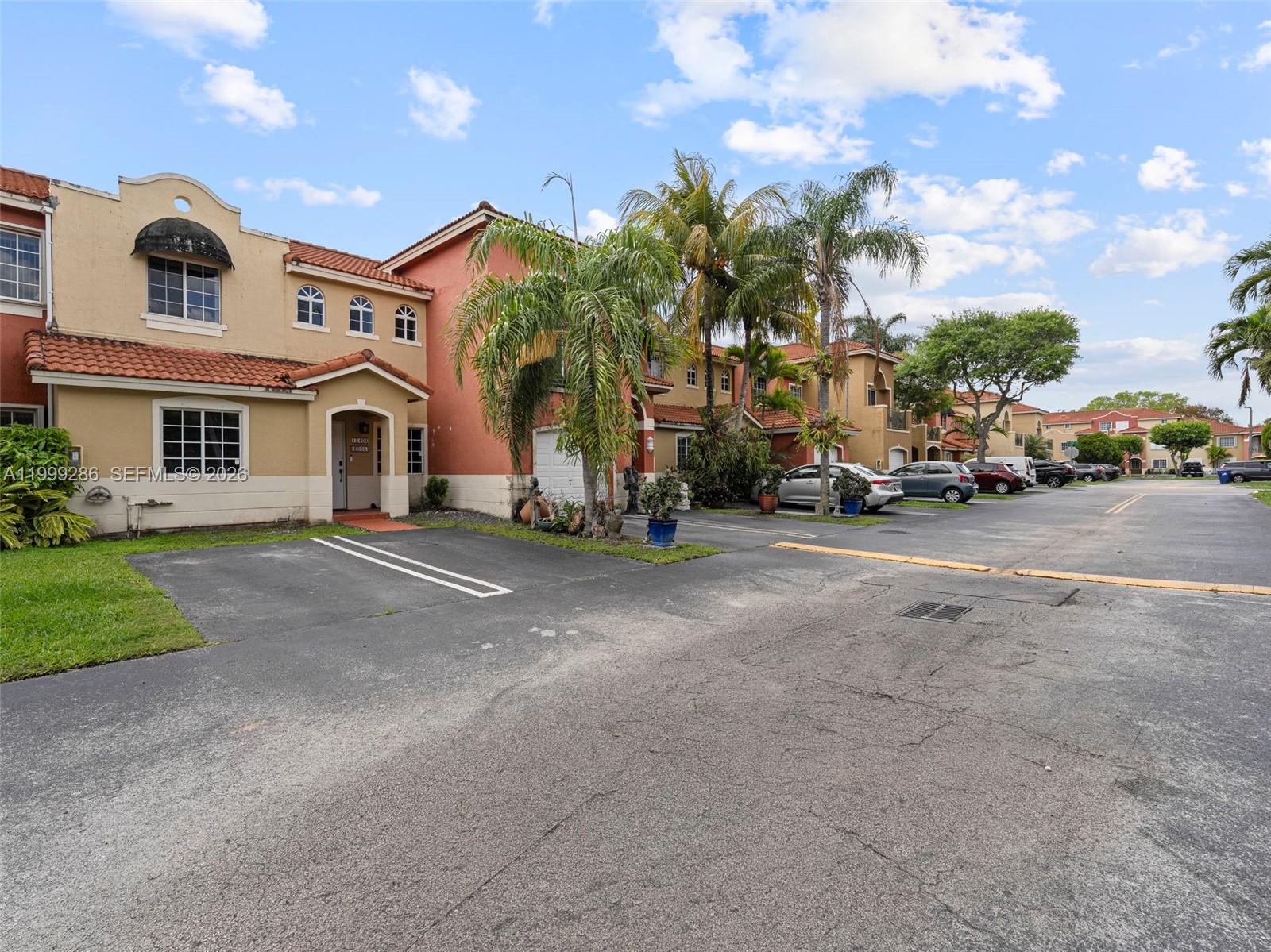 13404 Southwest 153 Terrace, Unit 2005 Miami, FL 33177 - Photo 37 of 49 a view of a street with a building