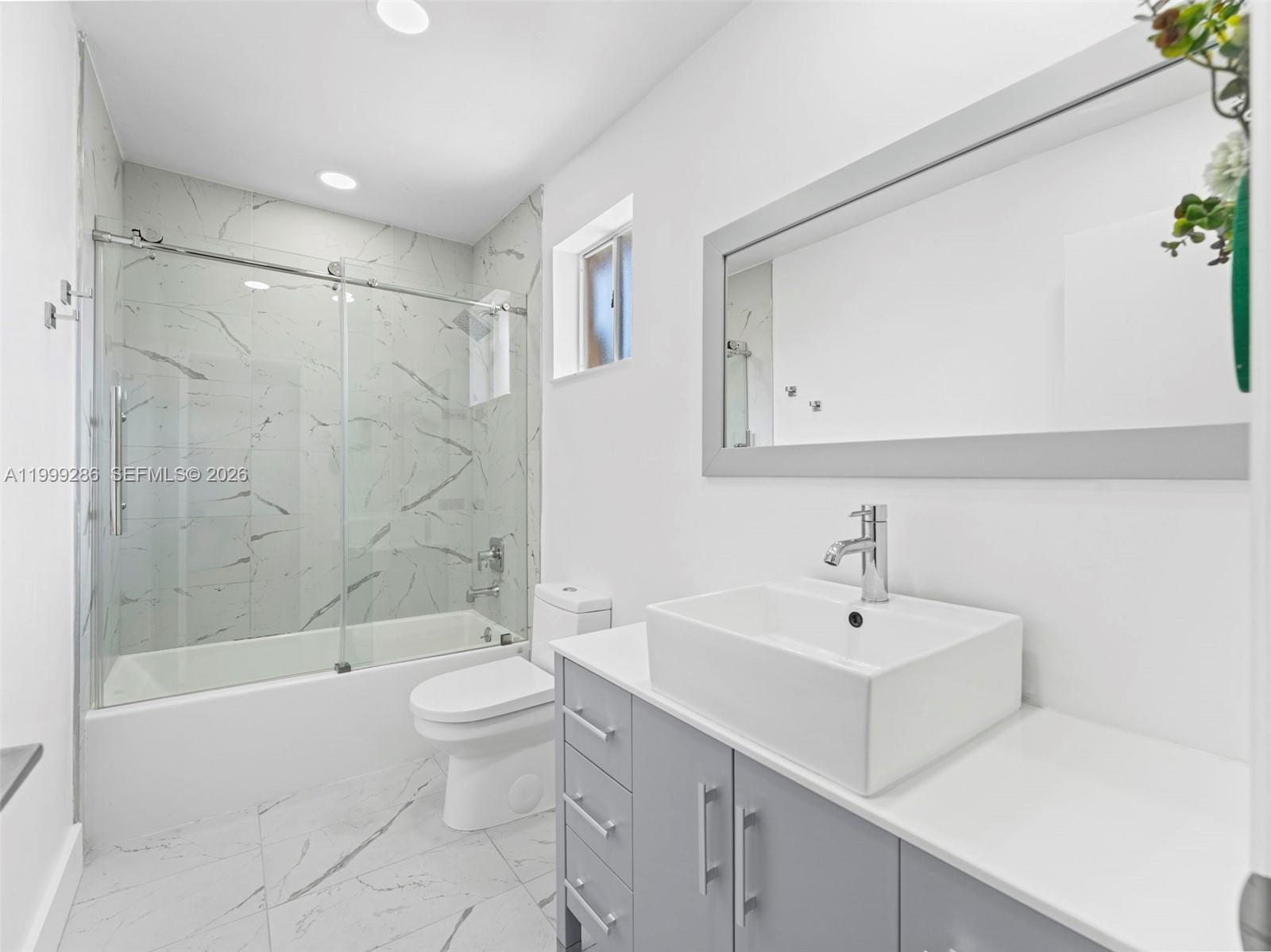 13404 Southwest 153 Terrace, Unit 2005 Miami, FL 33177 - Photo 40 of 49 a bathroom with a sink a toilet and shower