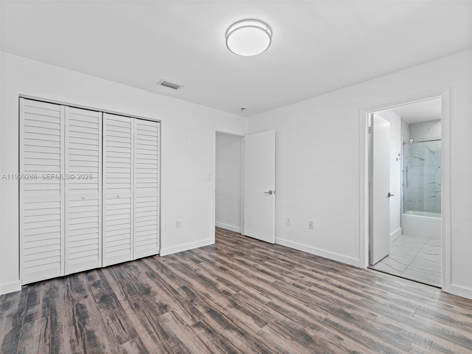 13404 Southwest 153 Terrace, Unit 2005 Miami, FL 33177 - Photo 42 of 49 an empty room with wooden floor and closet