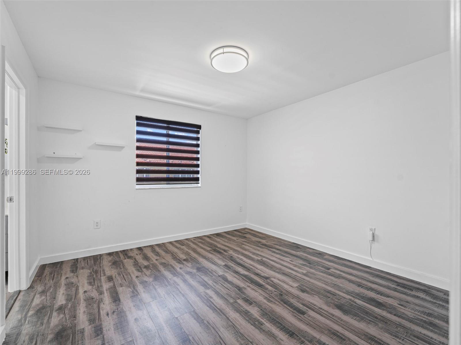 13404 Southwest 153 Terrace, Unit 2005 Miami, FL 33177 - Photo 43 of 49 a view of empty room with wooden floor and fan