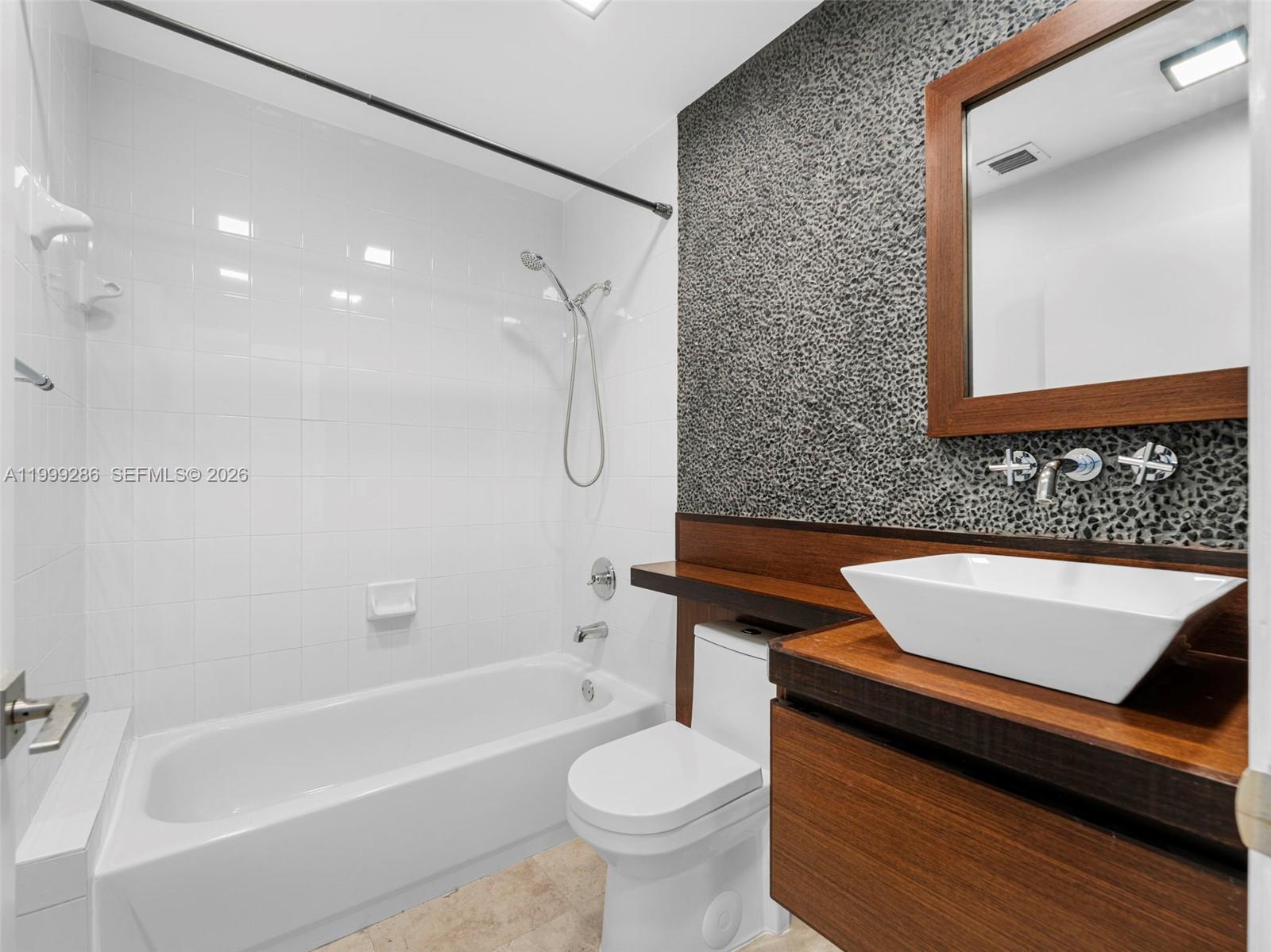 13404 Southwest 153 Terrace, Unit 2005 Miami, FL 33177 - Photo 9 of 49 a bathroom with a sink a toilet and a bathtub
