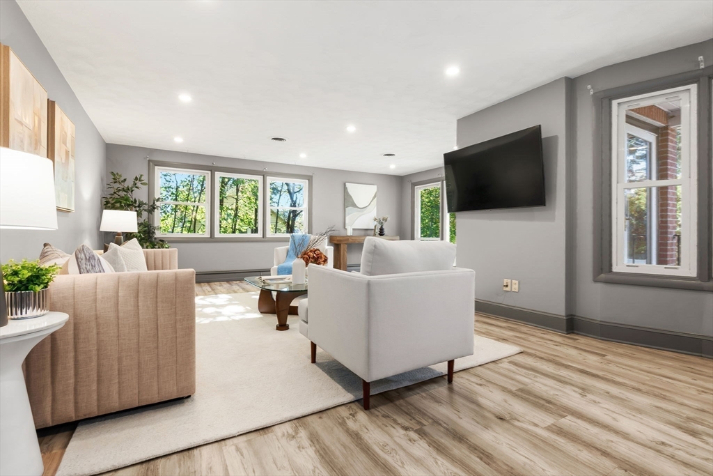 97 Oak Street Stoneham, MA 02180 - Photo 13 of 42 a living room with furniture and a flat screen tv