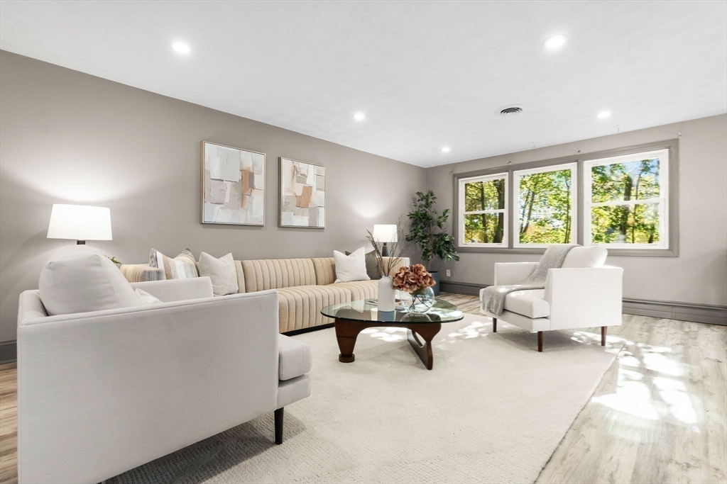 97 Oak Street Stoneham, MA 02180 - Photo 14 of 42 a living room with furniture and a large window