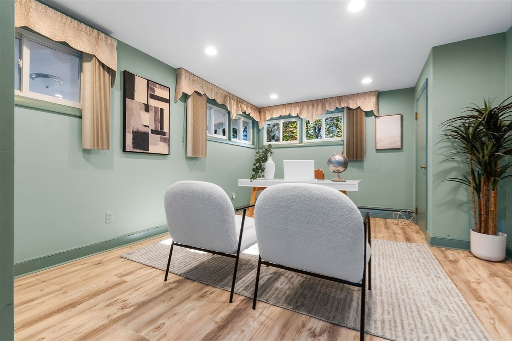 97 Oak Street Stoneham, MA 02180 - Photo 25 of 42 a living room with furniture and a wooden floor