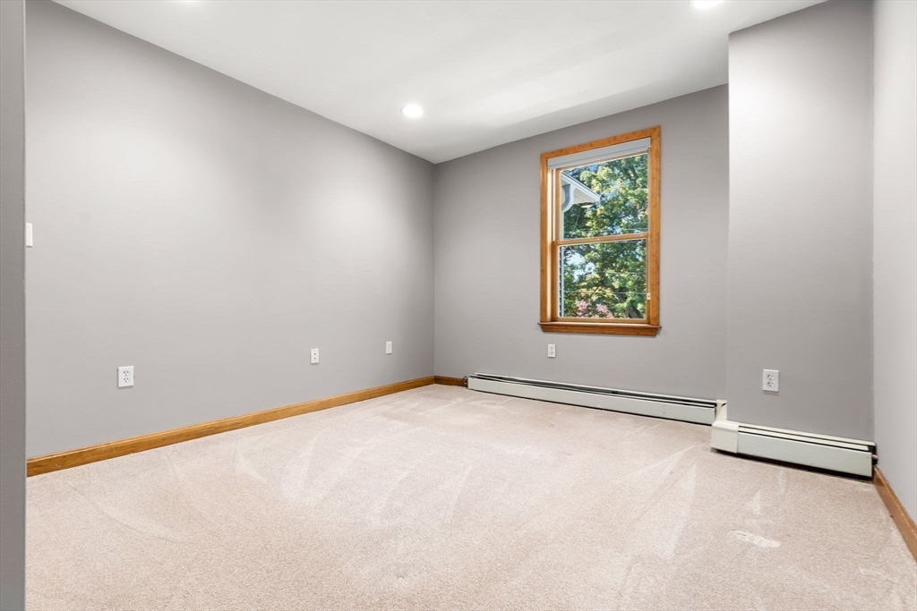 97 Oak Street Stoneham, MA 02180 - Photo 31 of 42 an empty room with windows