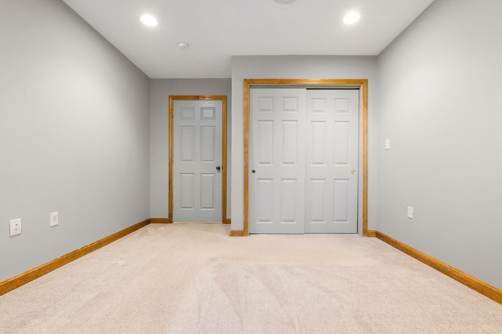 97 Oak Street Stoneham, MA 02180 - Photo 32 of 42 a view of an empty room with wooden door