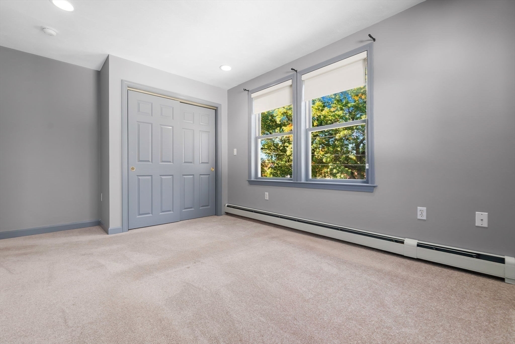 97 Oak Street Stoneham, MA 02180 - Photo 33 of 42 an empty room with windows