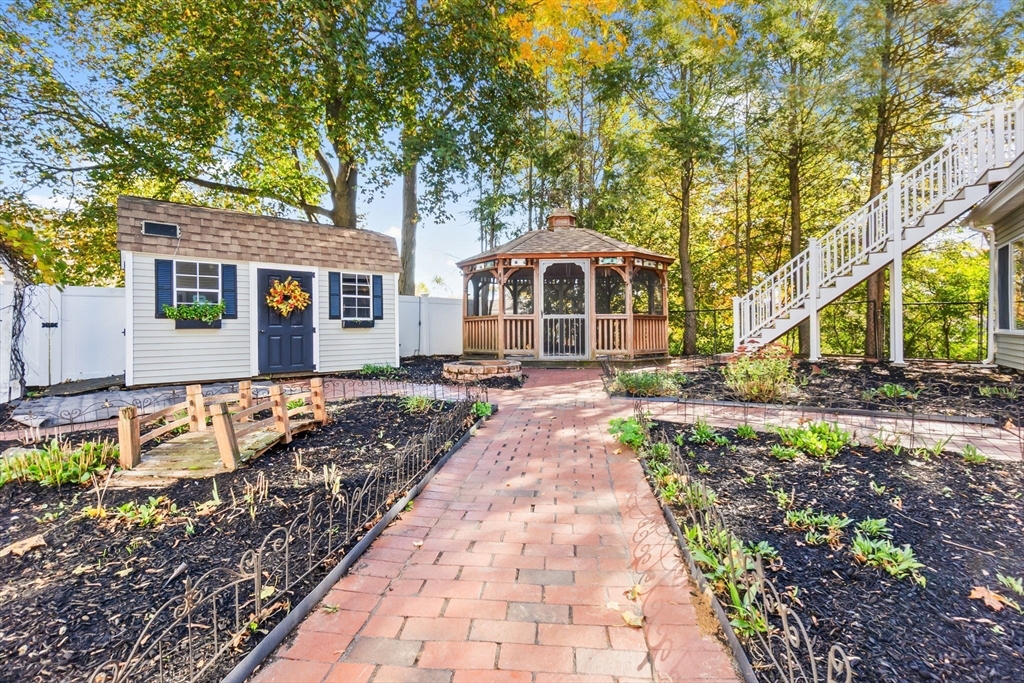 97 Oak Street Stoneham, MA 02180 - Photo 38 of 42 a front view of a house with a yard