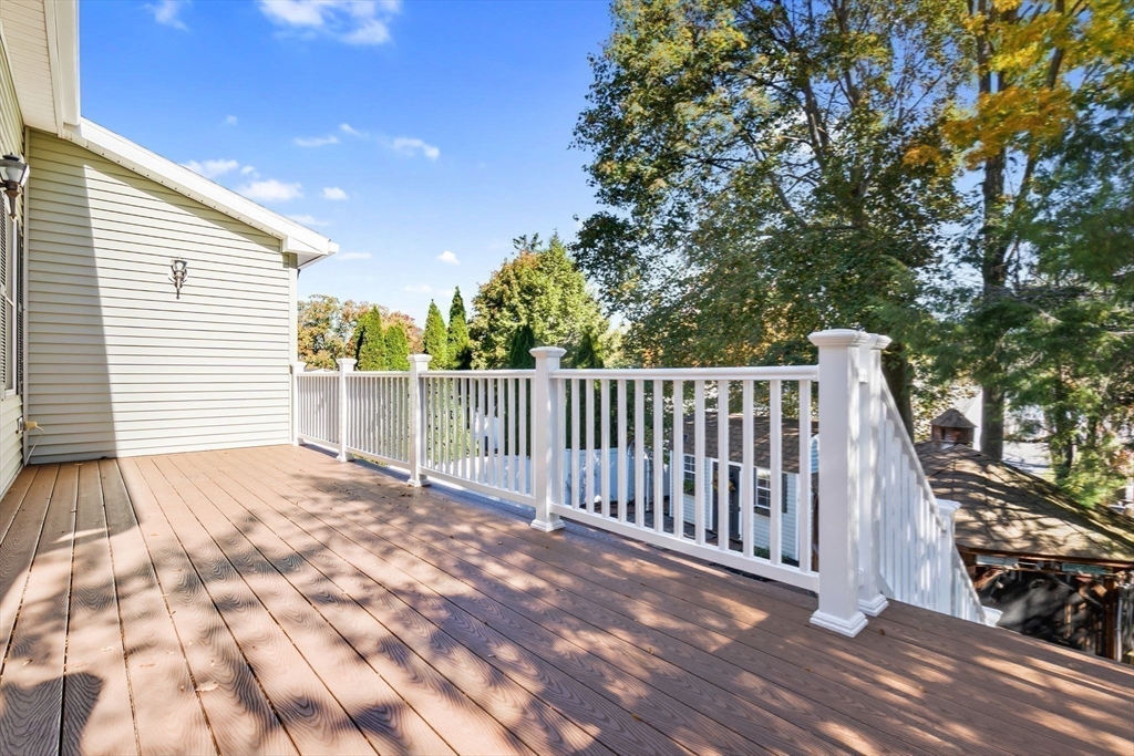 97 Oak Street Stoneham, MA 02180 - Photo 39 of 42 a view of backyard with wooden fence and large trees