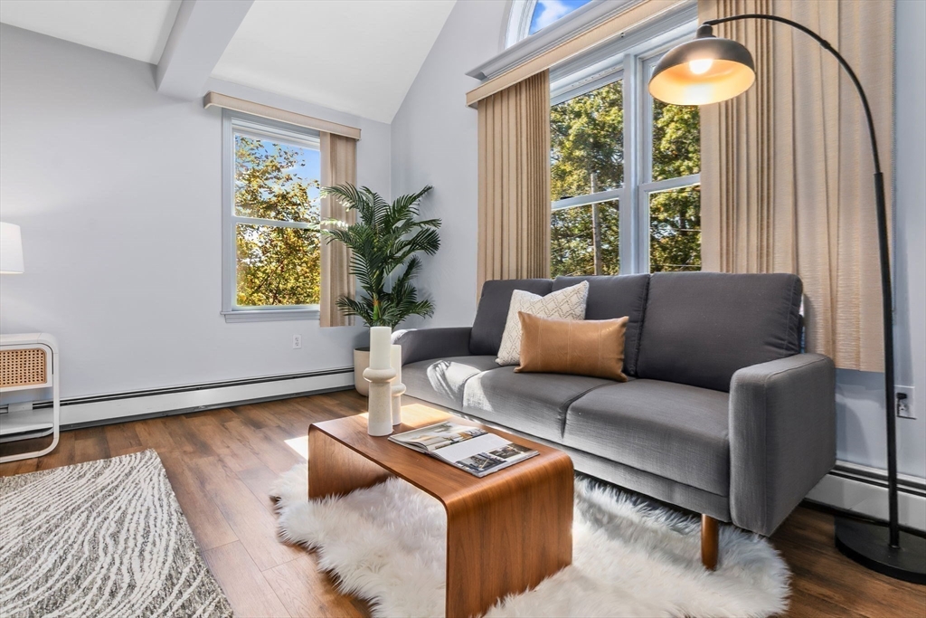 97 Oak Street Stoneham, MA 02180 - Photo 4 of 42 a living room with furniture and a large window