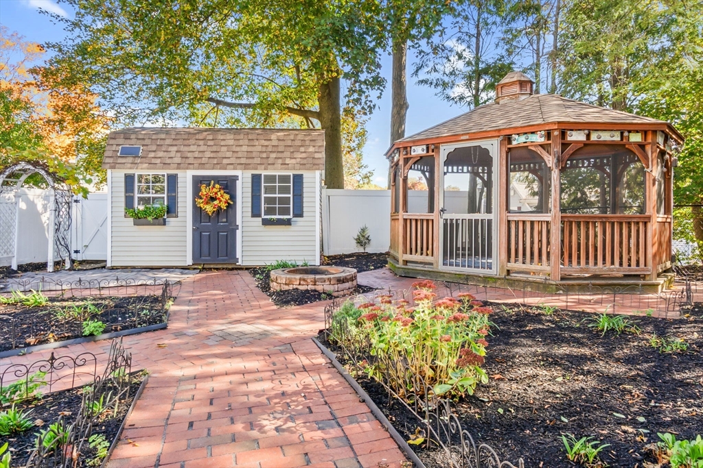 97 Oak Street Stoneham, MA 02180 - Photo 41 of 42 a front view of a house with garden