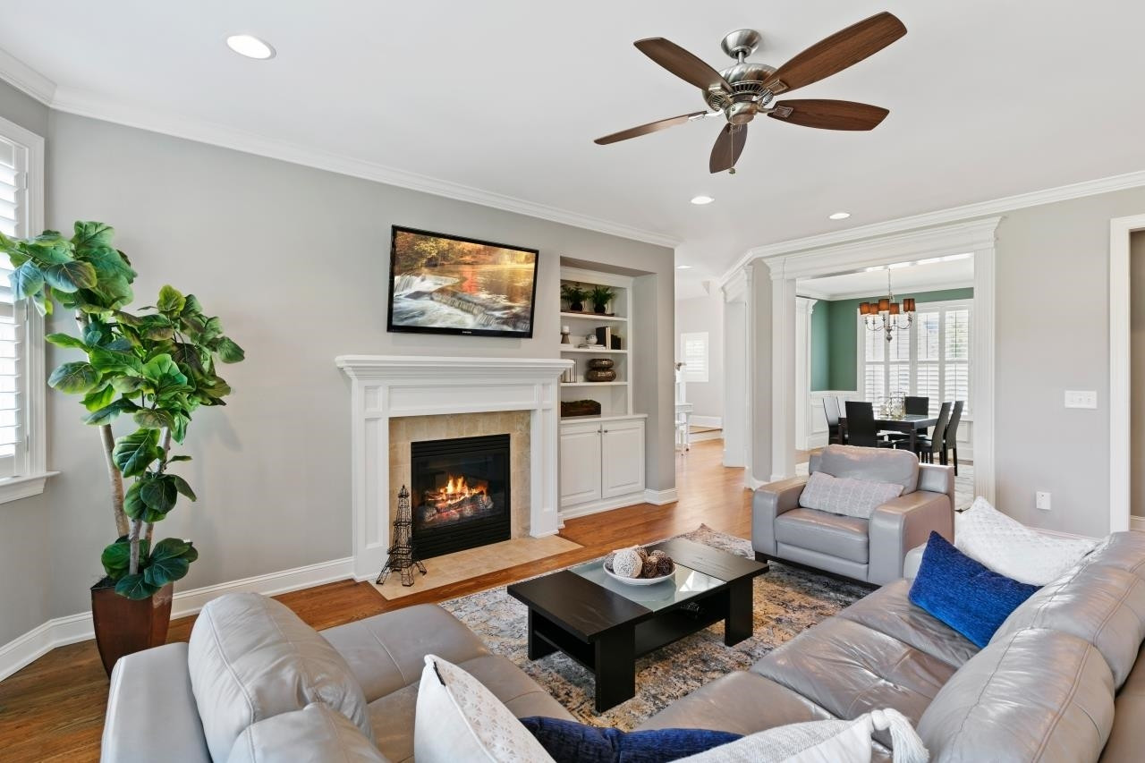 2800 Romealia Lane Raleigh, NC 27613 - Photo 5 of 33 The spacious family room features a direct vent, natural gas fireplace, site finished hardwood floors and is awash in natural light coming from the bank of windows that feature plantation shutters. Family Room