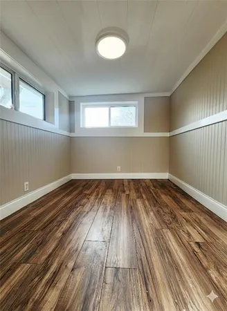 a view of wooden floor in an empty room