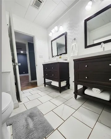 a bathroom with a sink and a shower