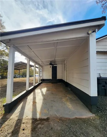 a view of a house with a yard and garage