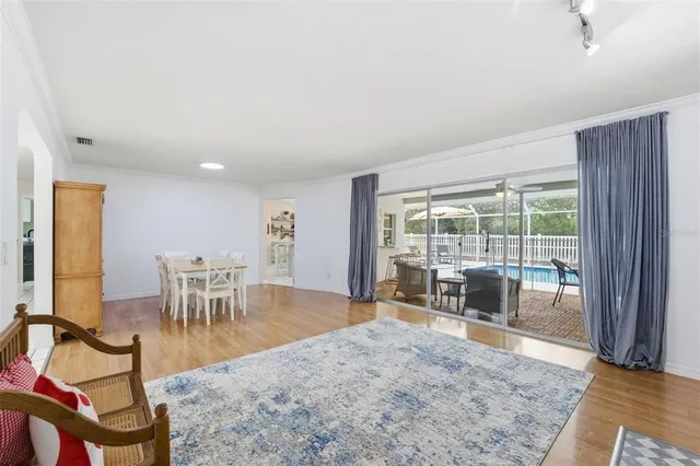 a bathroom with a sink a toilet and a large mirror