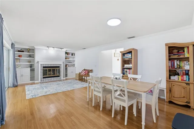 a view of a dining room with furniture and chandelier