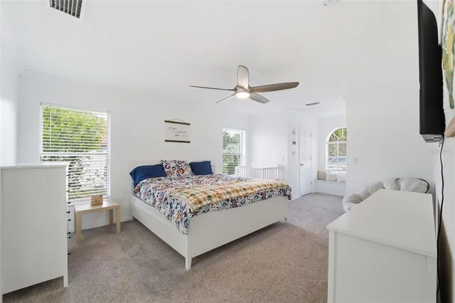 a front view of house with yard and trees in the background