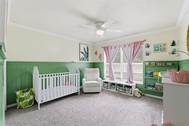 an aerial view of a house with a yard basket ball court and outdoor seating