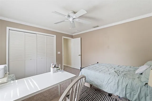an aerial view of a house with a yard and outdoor seating