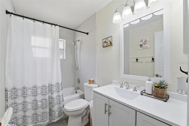 a front view of a house with a yard and a garage