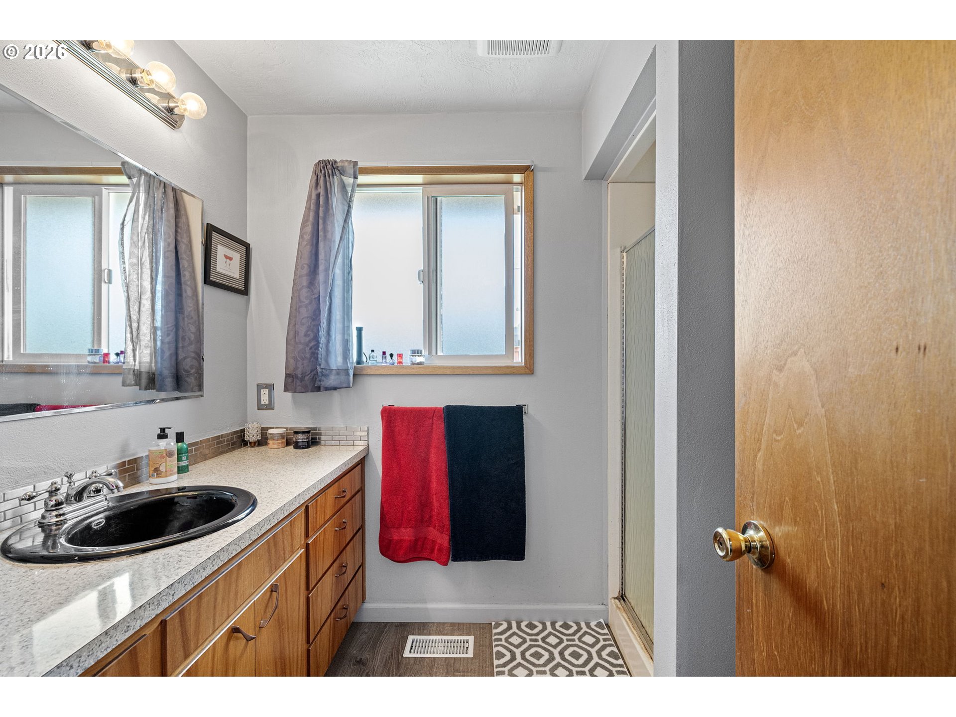 2465 17th Street Springfield, OR 97477 - Photo 35 of 47 a bathroom with a sink and a mirror