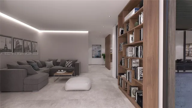 a living room with furniture a bookshelf and a window